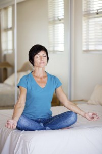middle aged woman yoga meditation