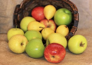 a basket of ripe apples and pears