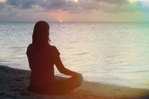woman meditation on the beach