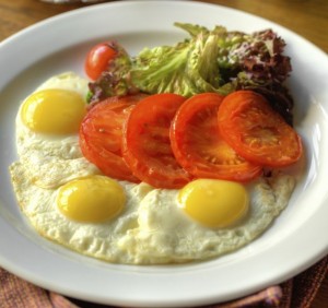 Fried eggs with roasted tomatoes