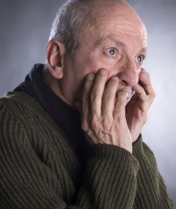 Portrait of surprised elderly man